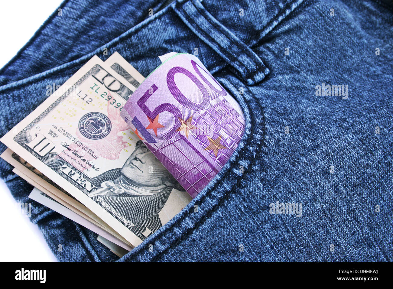 Money in blue jeans pocket on white background Stock Photo - Alamy