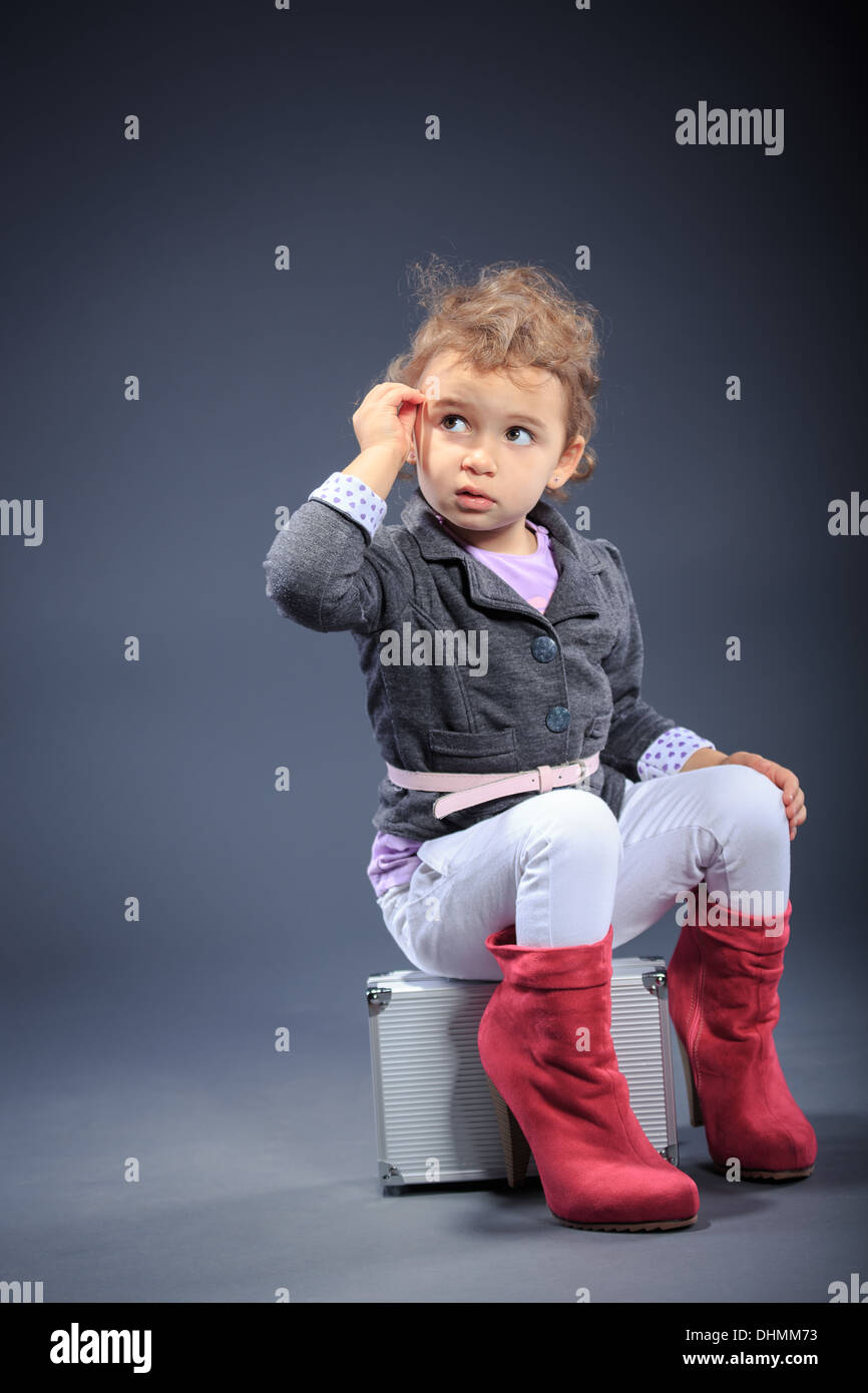 studio shot of a little dressed up girl Stock Photo