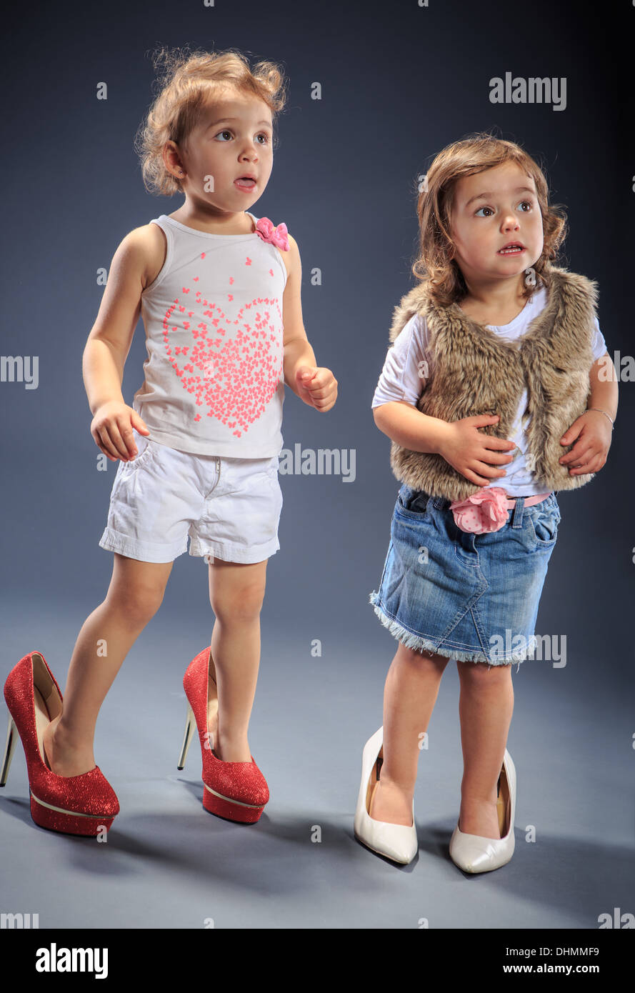 studio shot of two little dressed up girls Stock Photo