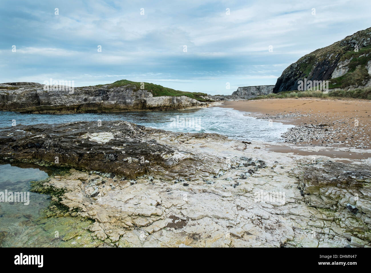 Basalt and Limestone outcrops on a beach near Ballintoy, Co Antrim, Northern Ireland.  A blend of subtle shades. Stock Photo