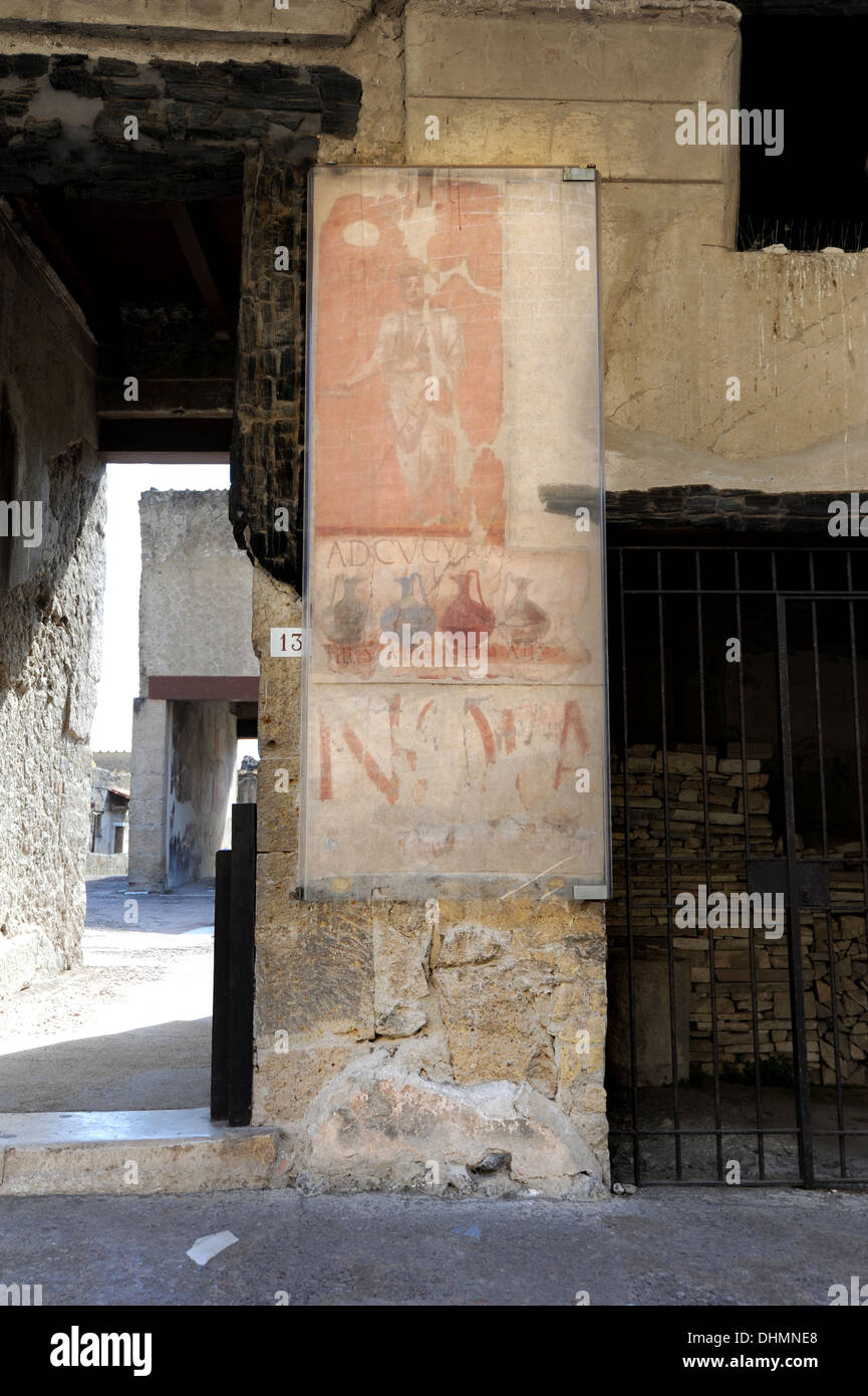 A sign advertising a wine shop on the main street in Herculaneum Stock Photo