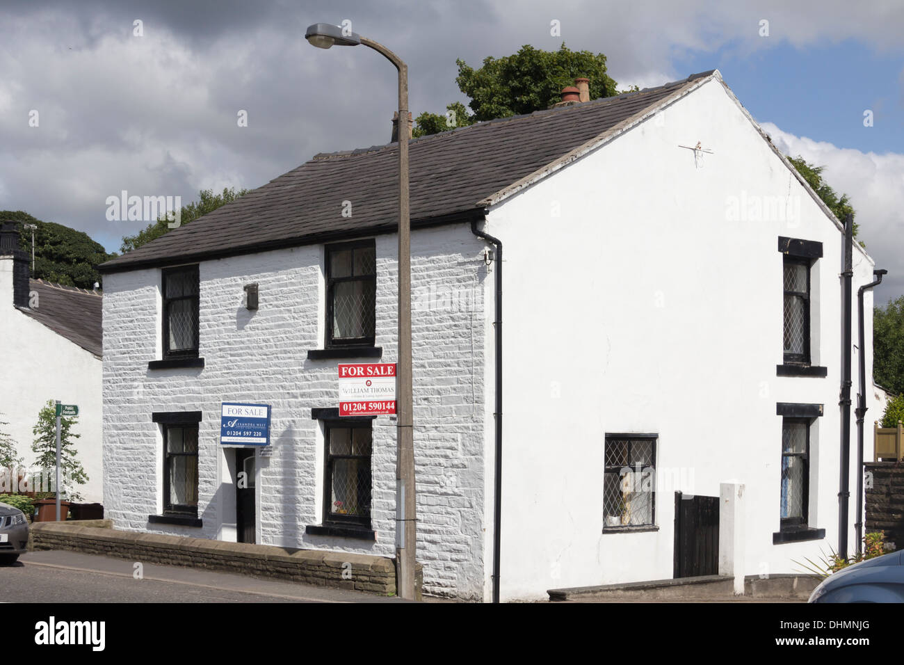 A stone-built white detached house for sale in the village of Edgworth, Turton, Lancashire. Stock Photo