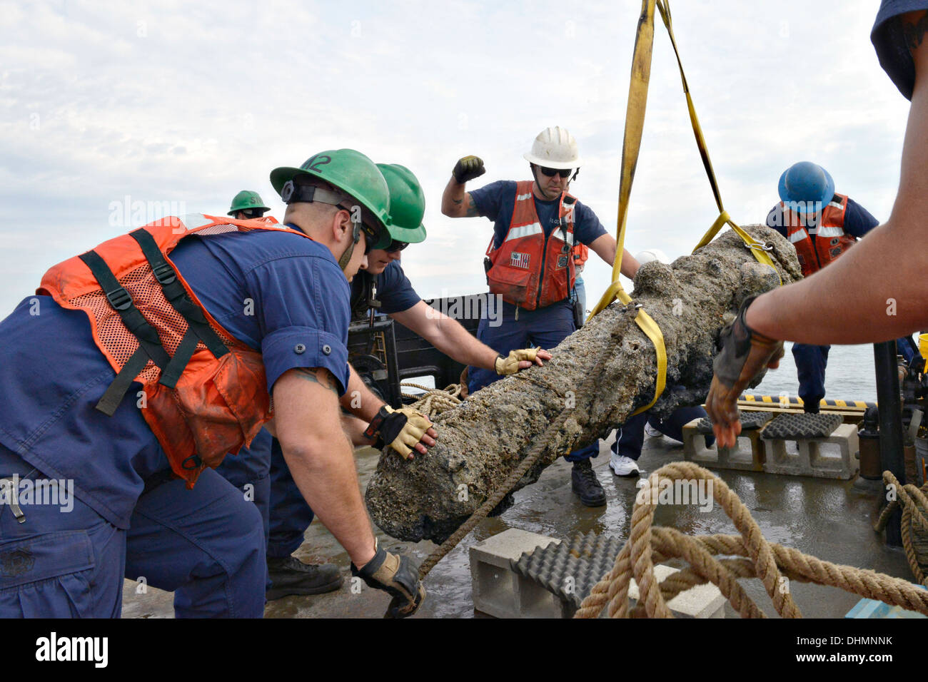 The crew of the Coast Guard Cutter Smilax work with the North Carolina