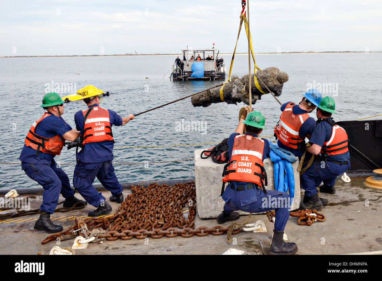 The crew of the Coast Guard Cutter Smilax work with the North Carolina