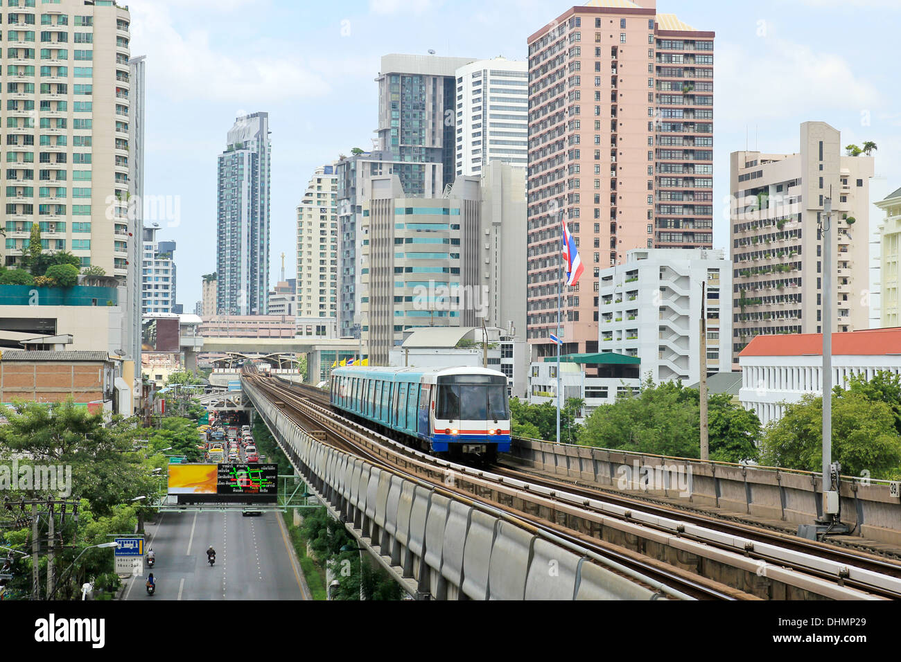 Sky train railway in Bangkok with business building Stock Photo