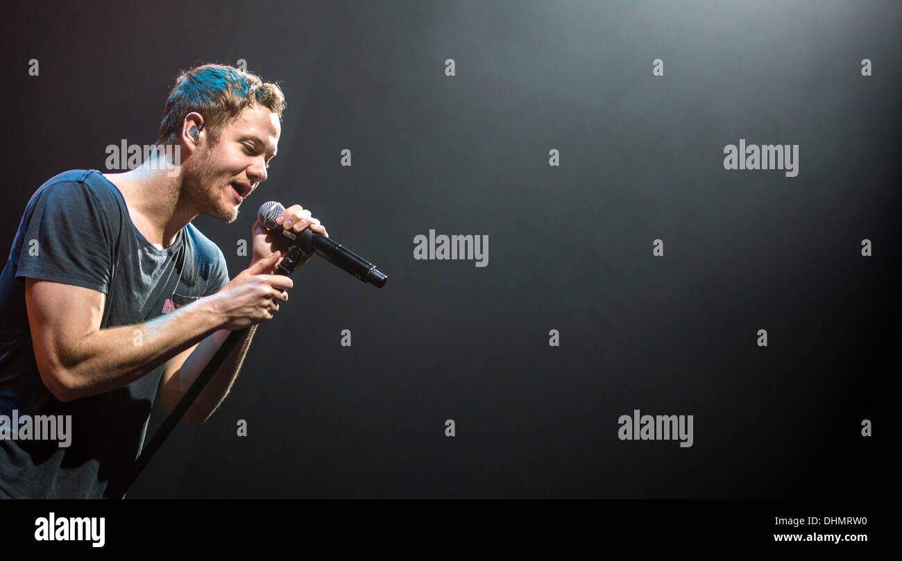 Munich, Germany. 11th Nov, 2013. Singer of US indie-rock band Imagine Dragons, Dan Reynolds, sings during a concert of the 'Night Visions Tour' in Munich, Germany, 11 November 2013. Photo: Marc Mueller/dpa/Alamy Live News Stock Photo