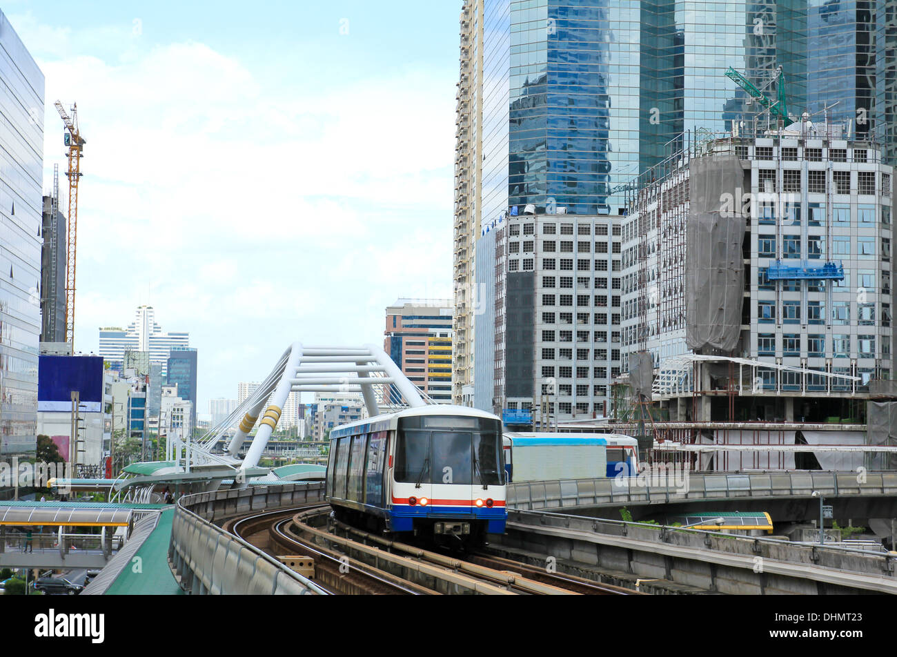 Sky train in Bangkok with business building Stock Photo