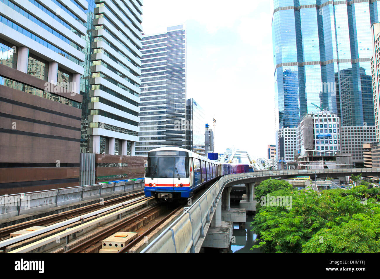 Sky train in Bangkok with business building Stock Photo