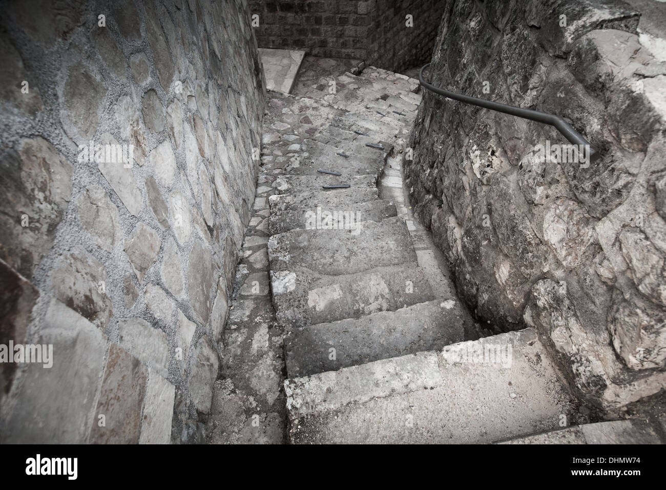 Old stone stairway on the street of Perast town, Montenegro Stock Photo