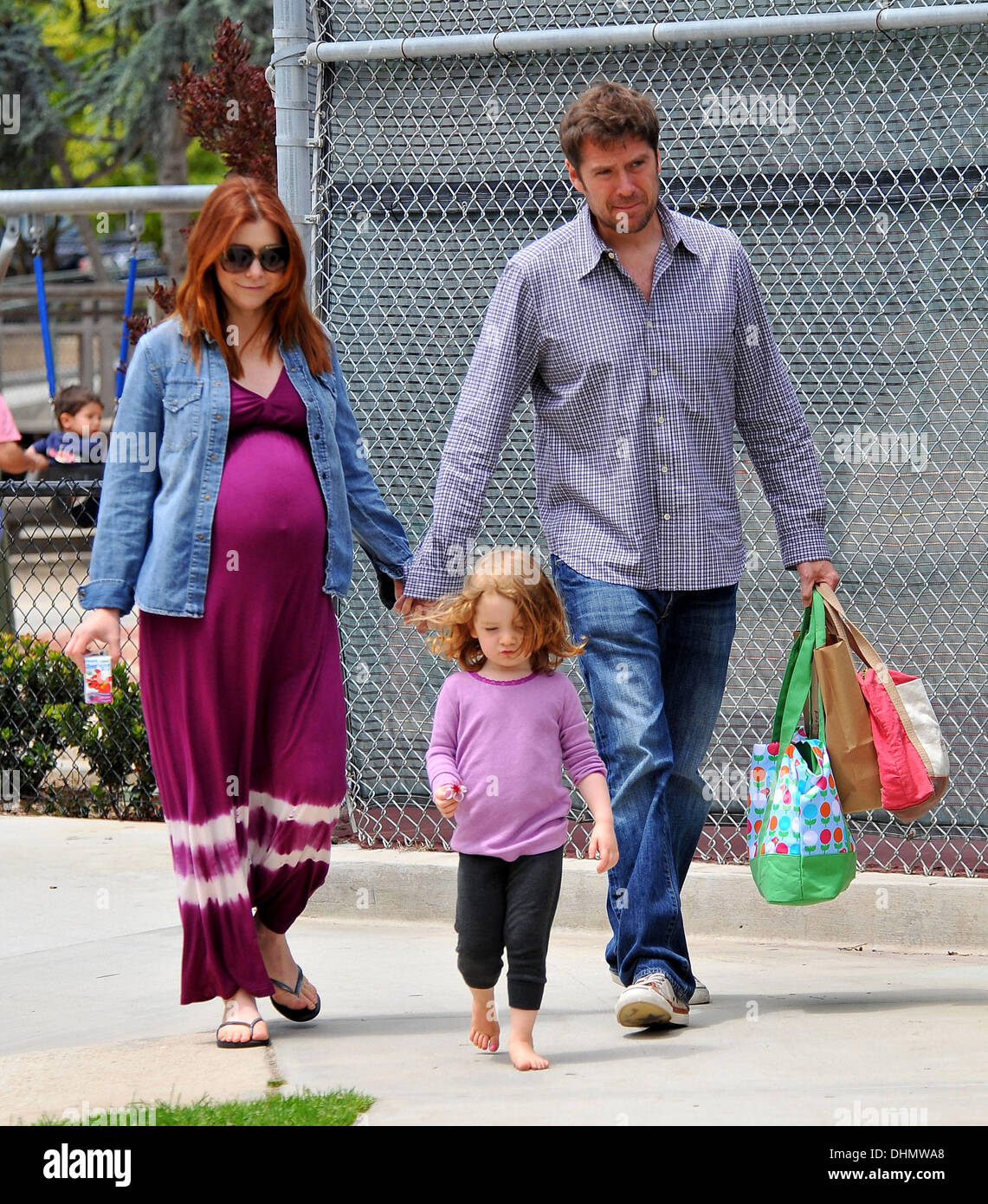 Pregnant Alyson Hannigan at the park with husband Alexis Denisof and