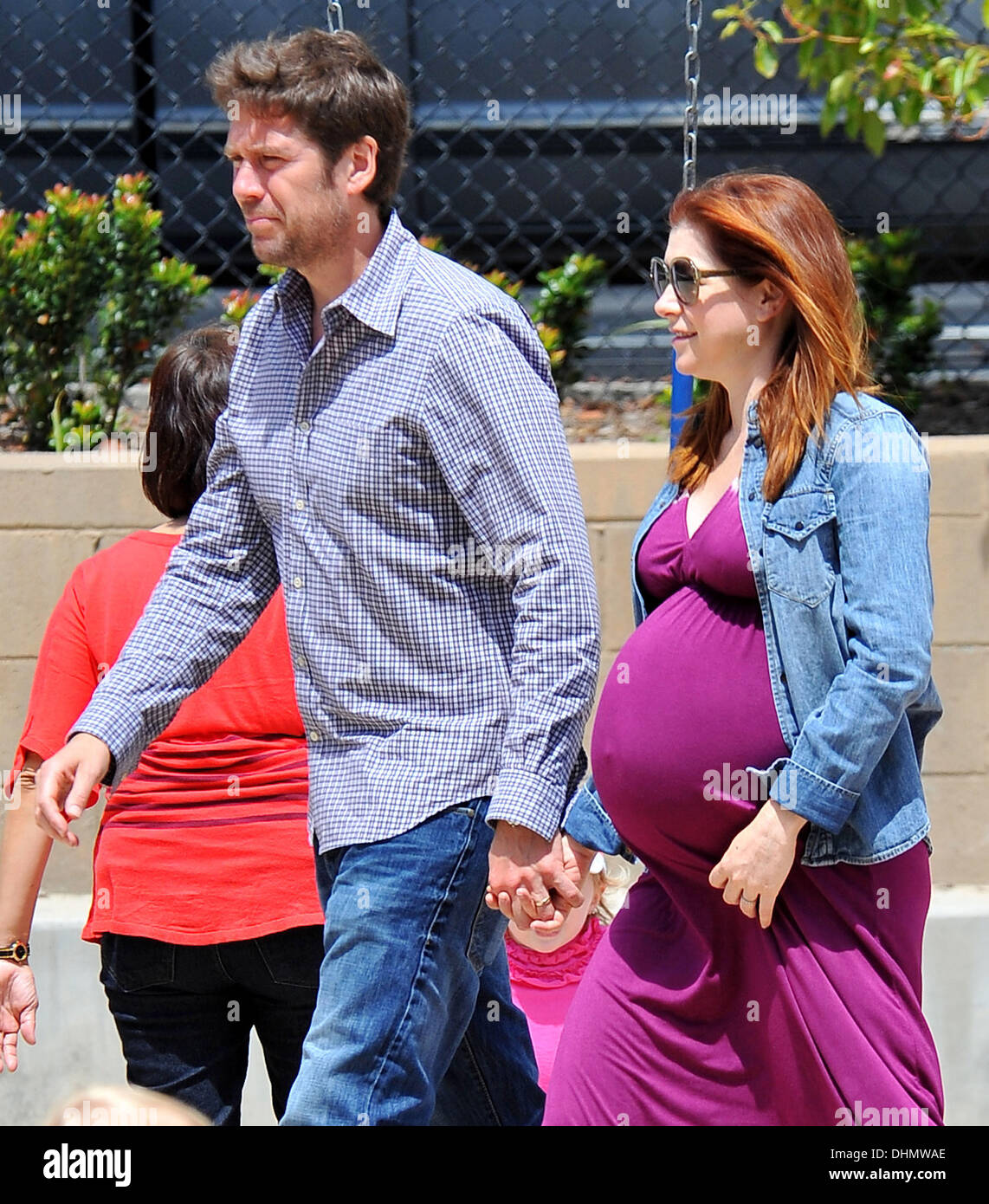 Pregnant Alyson Hannigan at the park with husband Alexis Denisof and