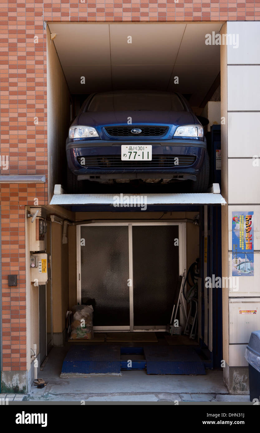 A car parked in a very small alcove in a house in Tokyo, Japan Stock