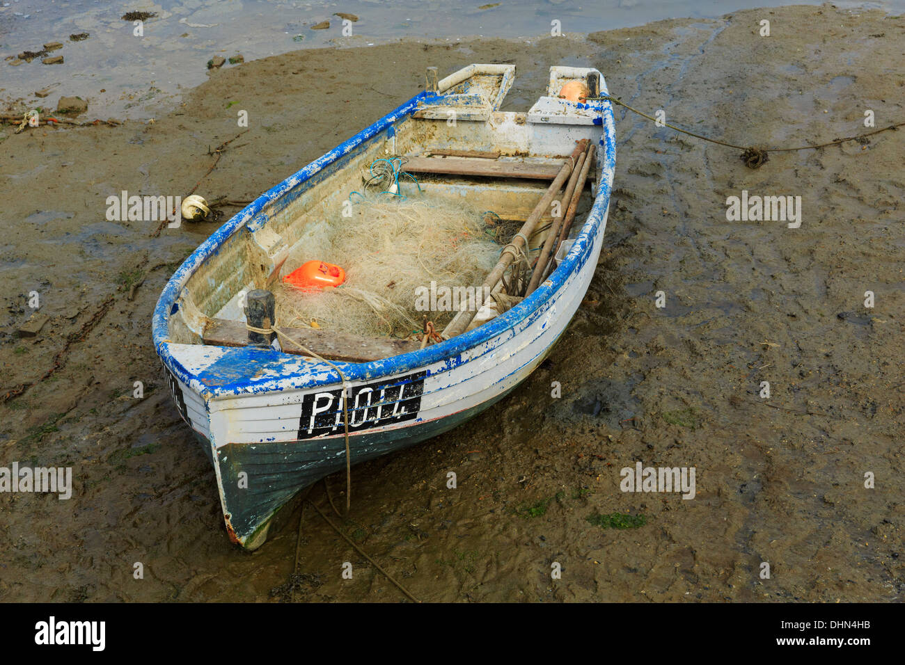 Fishing dinghy at low tide Stock Photo Alamy