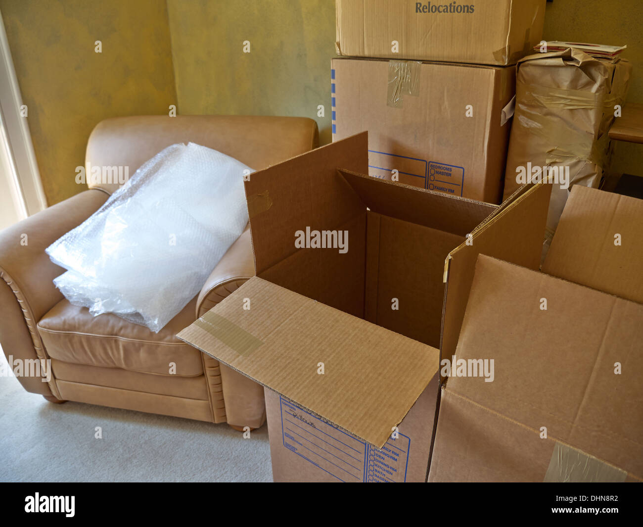 Packed and partially packed boxes for moving. Bubble wrap is ready and