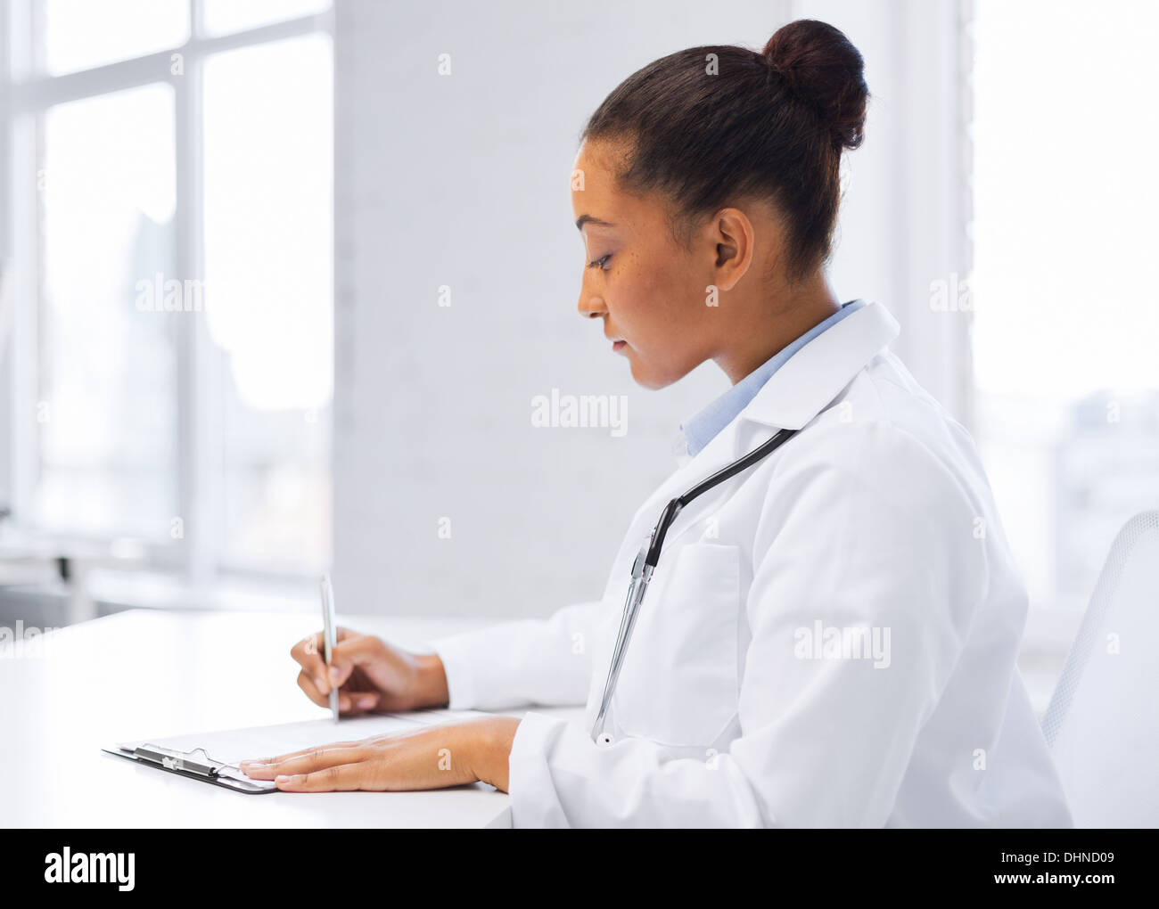 female doctor writing prescription Stock Photo - Alamy