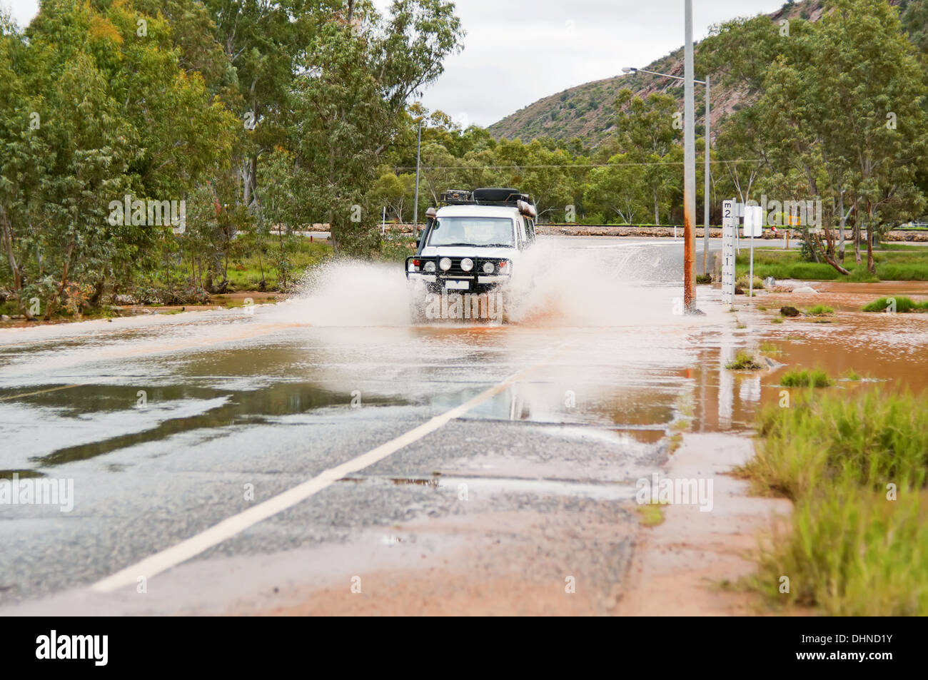 4WD crossing a floodway on an flooded road. Stock Photo
