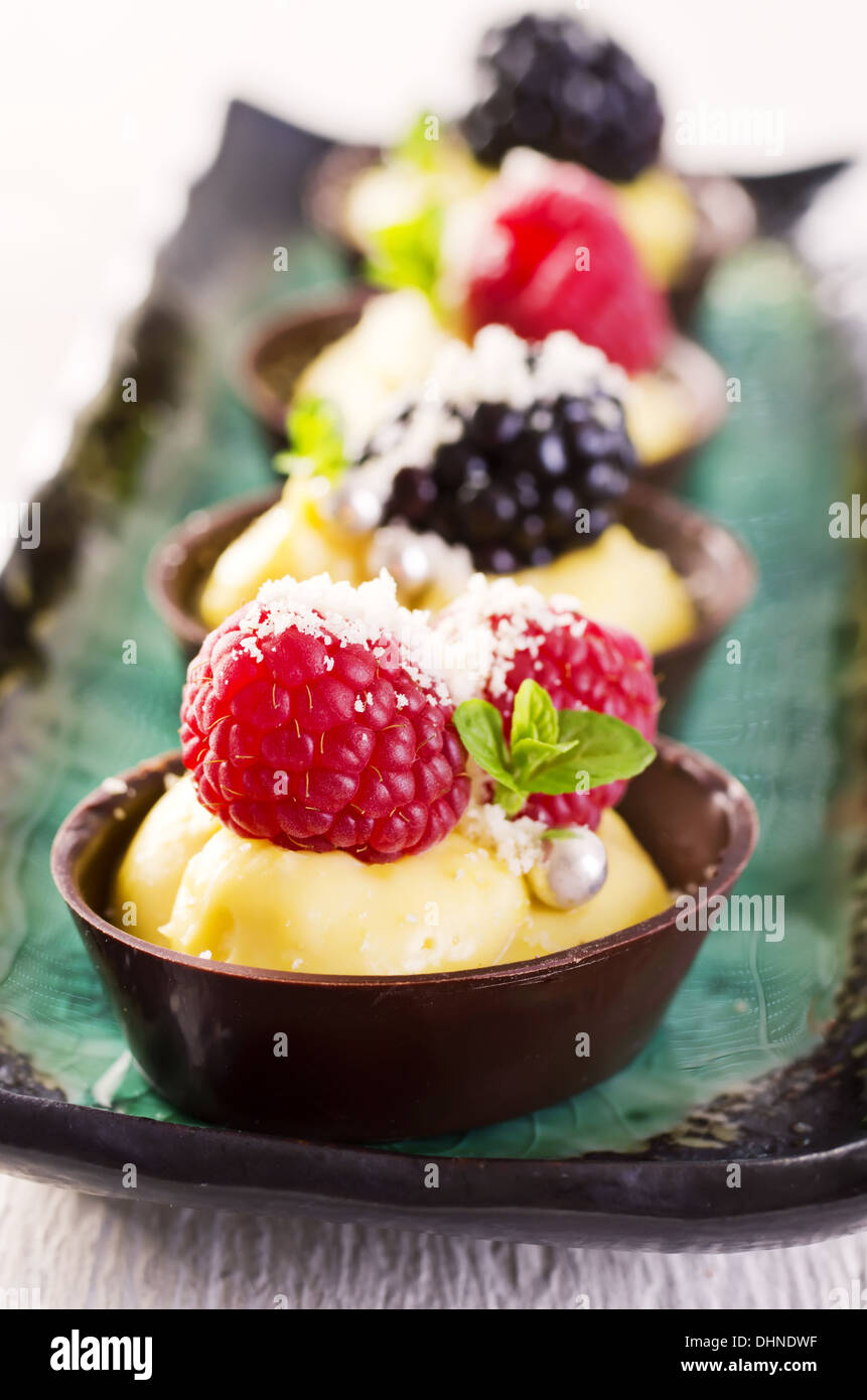 chocolate tartlets with berry topping Stock Photo