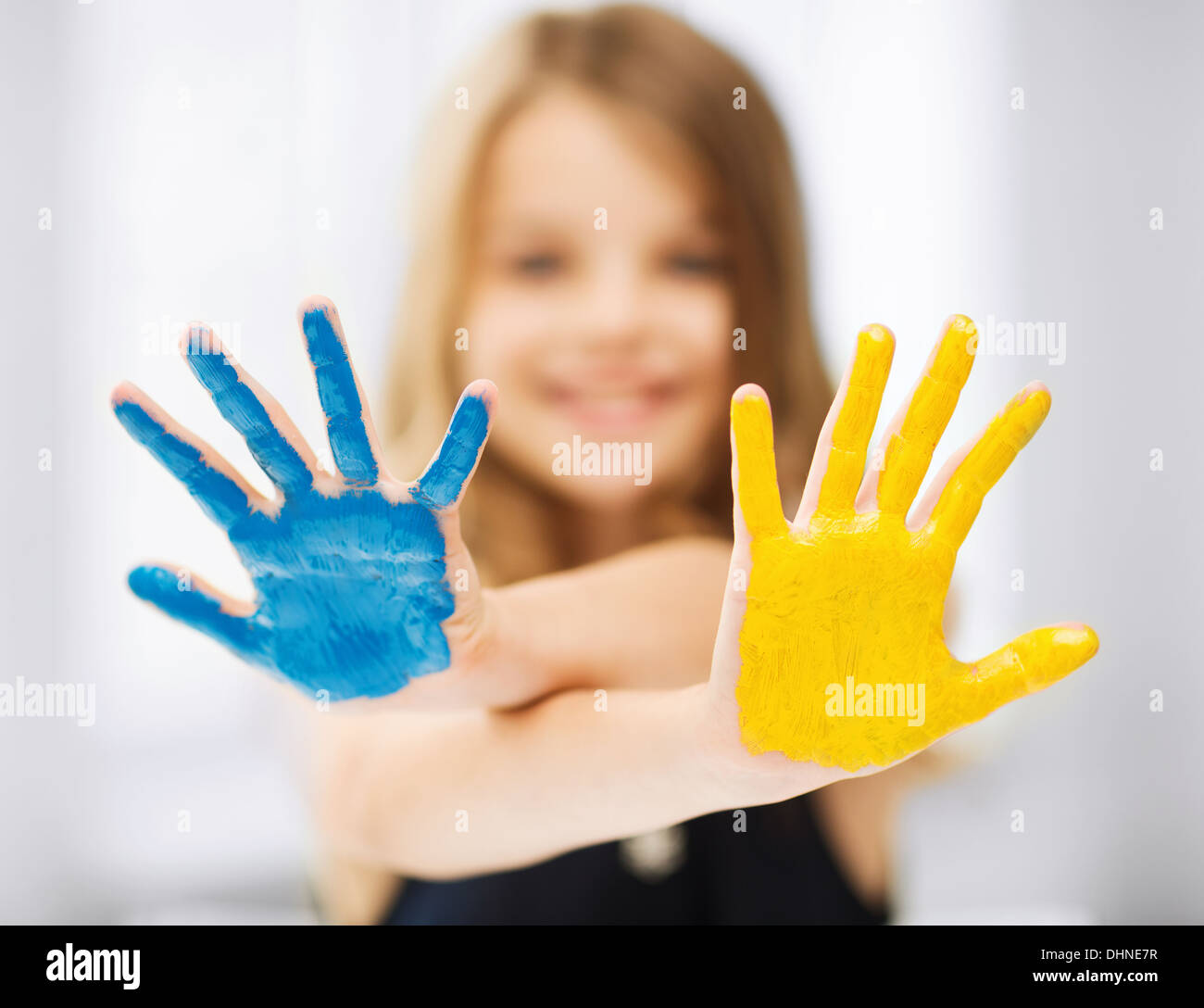 girl showing painted hands Stock Photo