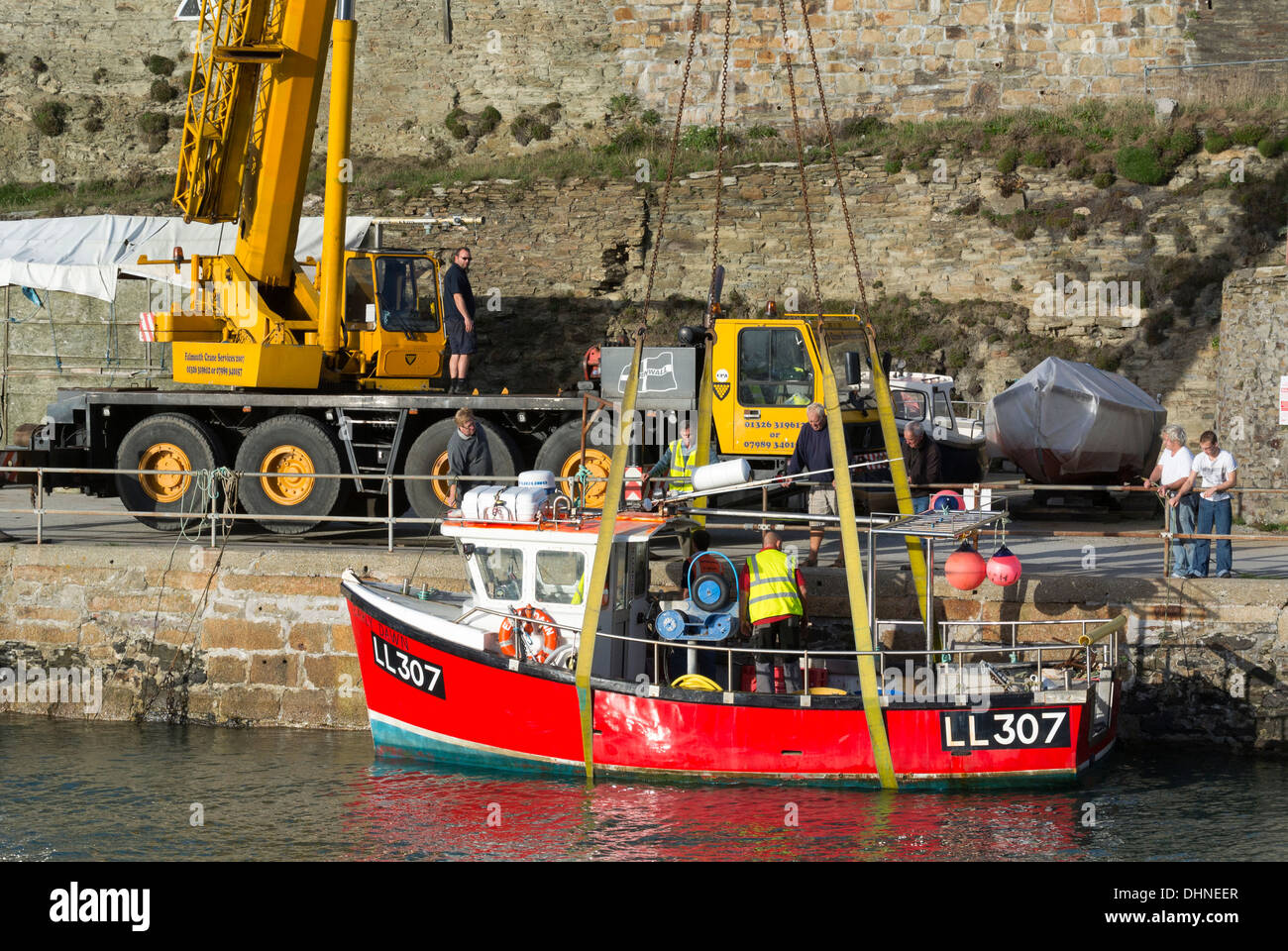 Lifting boat with mobile crane hi-res stock photography and images - Alamy