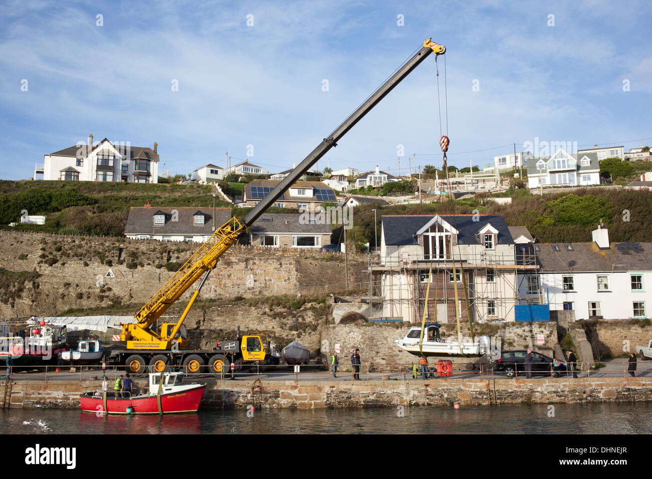 Lifting boat with mobile crane hi-res stock photography and images - Alamy