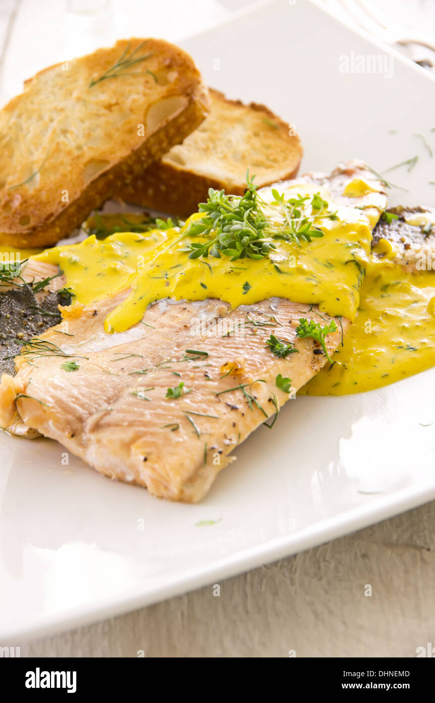 Fish fillet with saffron sauce Stock Photo Alamy