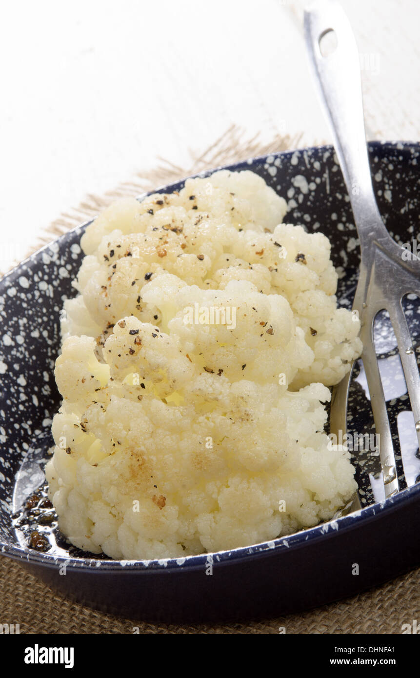 grilled organic cauliflower with pepper in a pan Stock Photo