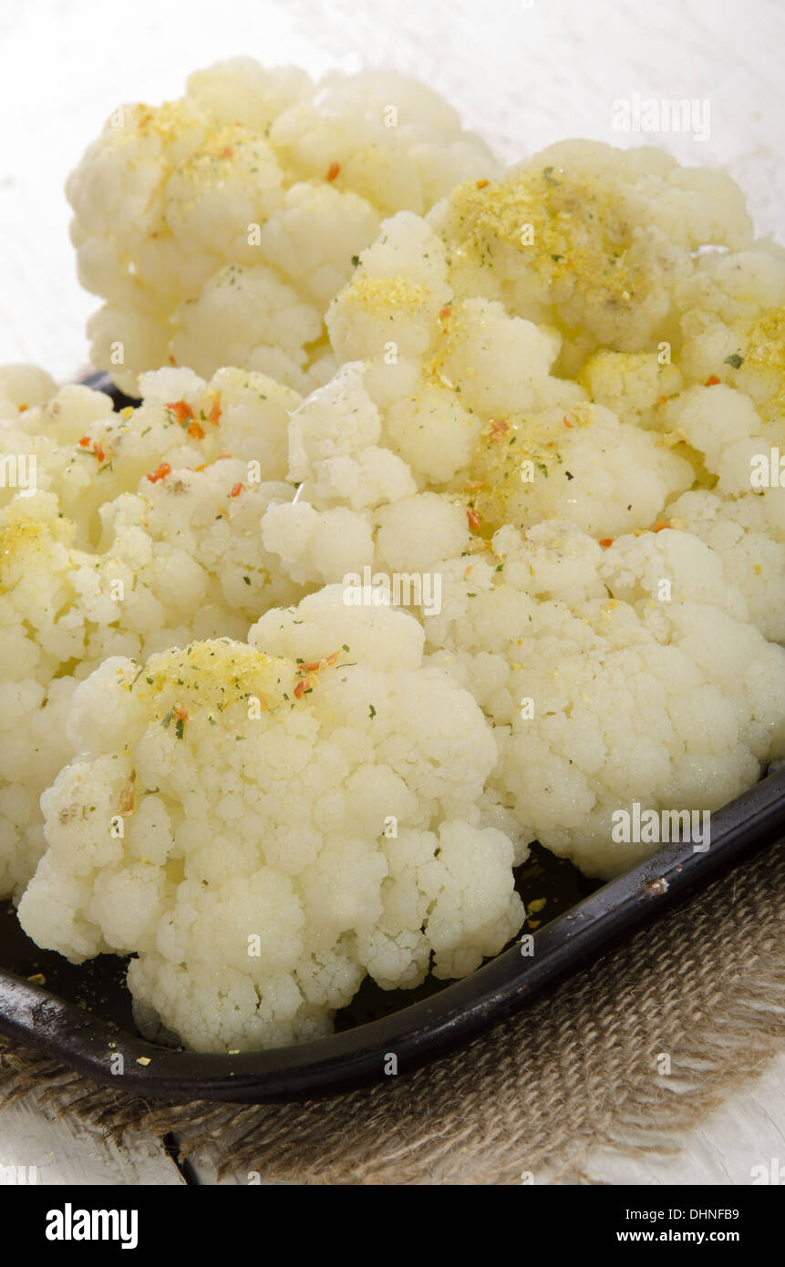 warm cauliflower with spice mix in an old black pan Stock Photo