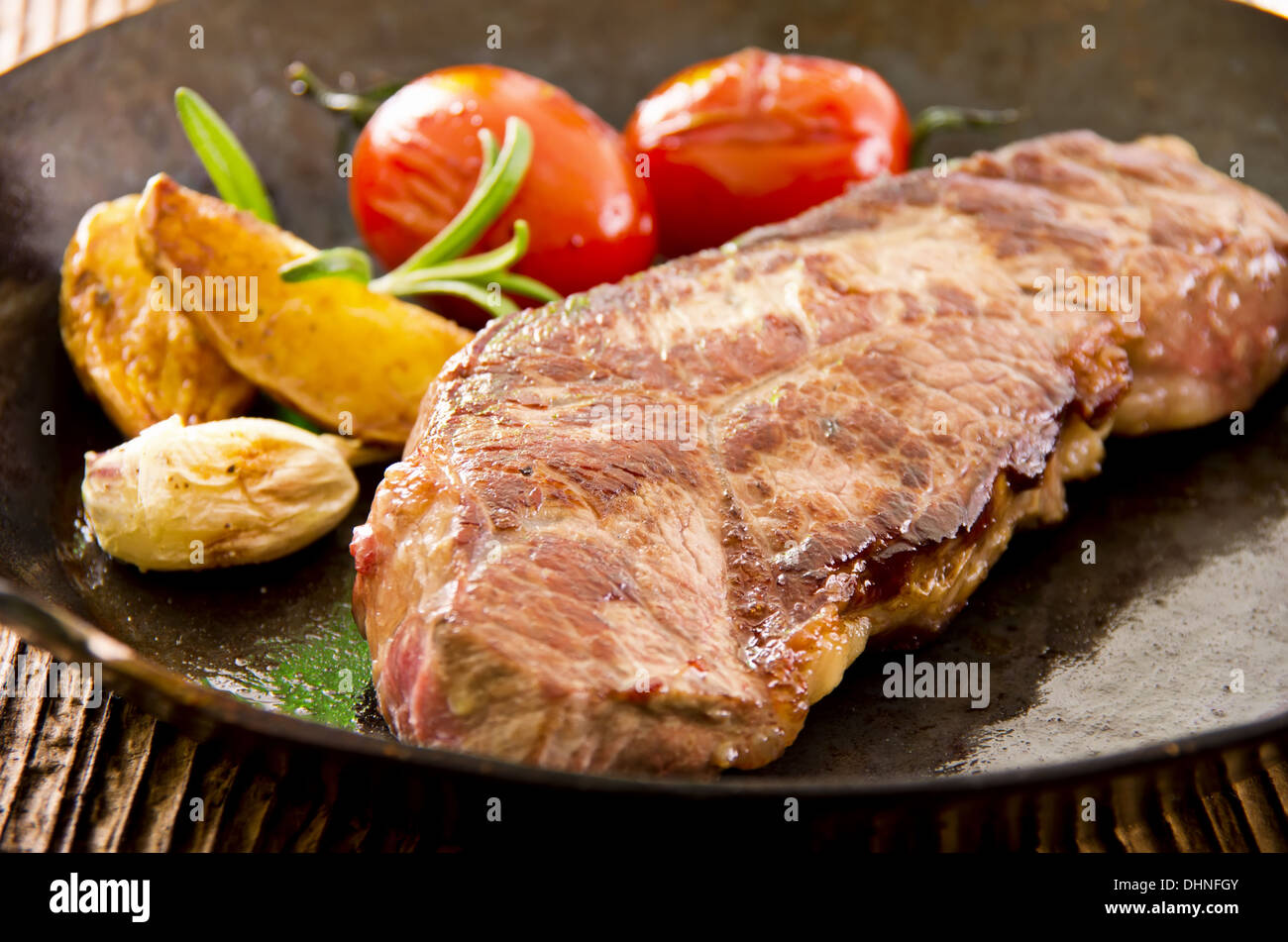 steak in the fry pan Stock Photo Alamy