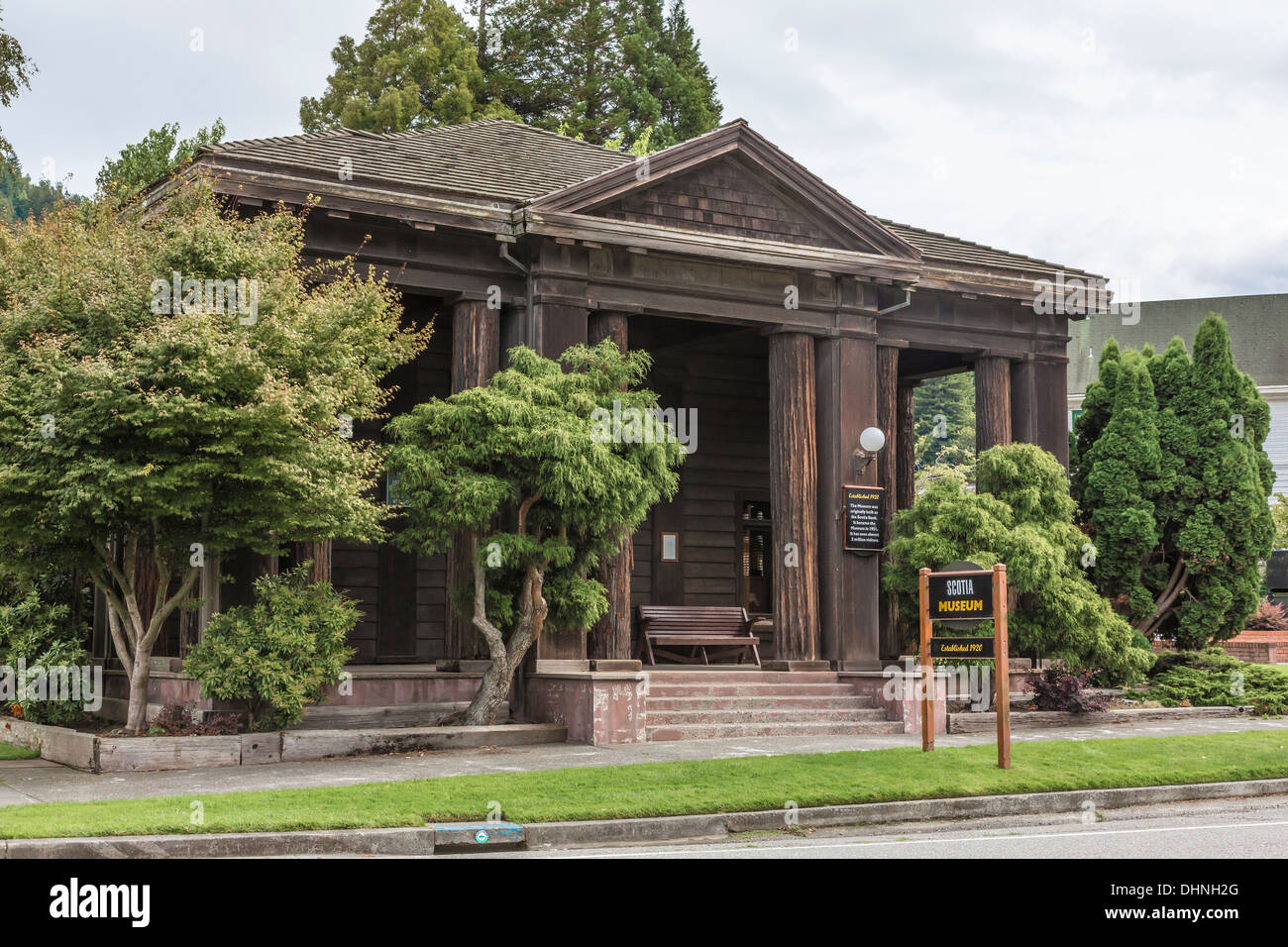 The Greek Revival style Scotia Museum, built in 1920 as a bank, includes beautiful redwood trunk columns in front, California Stock Photo