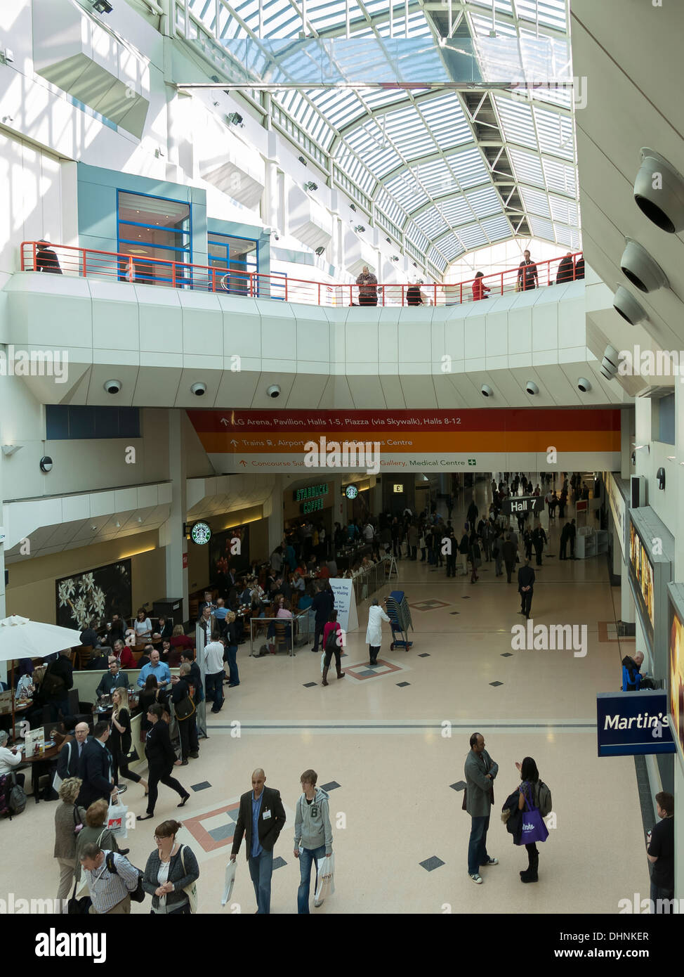 Busy Atrium walkway at the NEC National Exhibition Centre, Birmingham, England, UK. Stock Photo