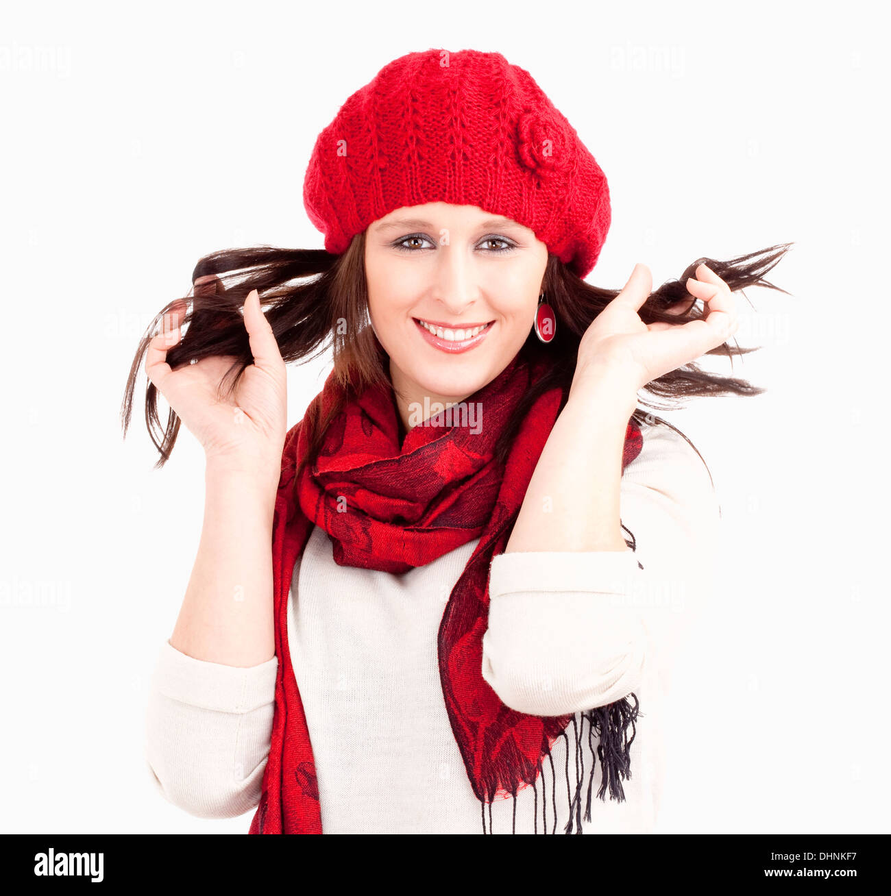 Young Woman in Red Cap and Scarf Smiling - Isolated on White Stock Photo