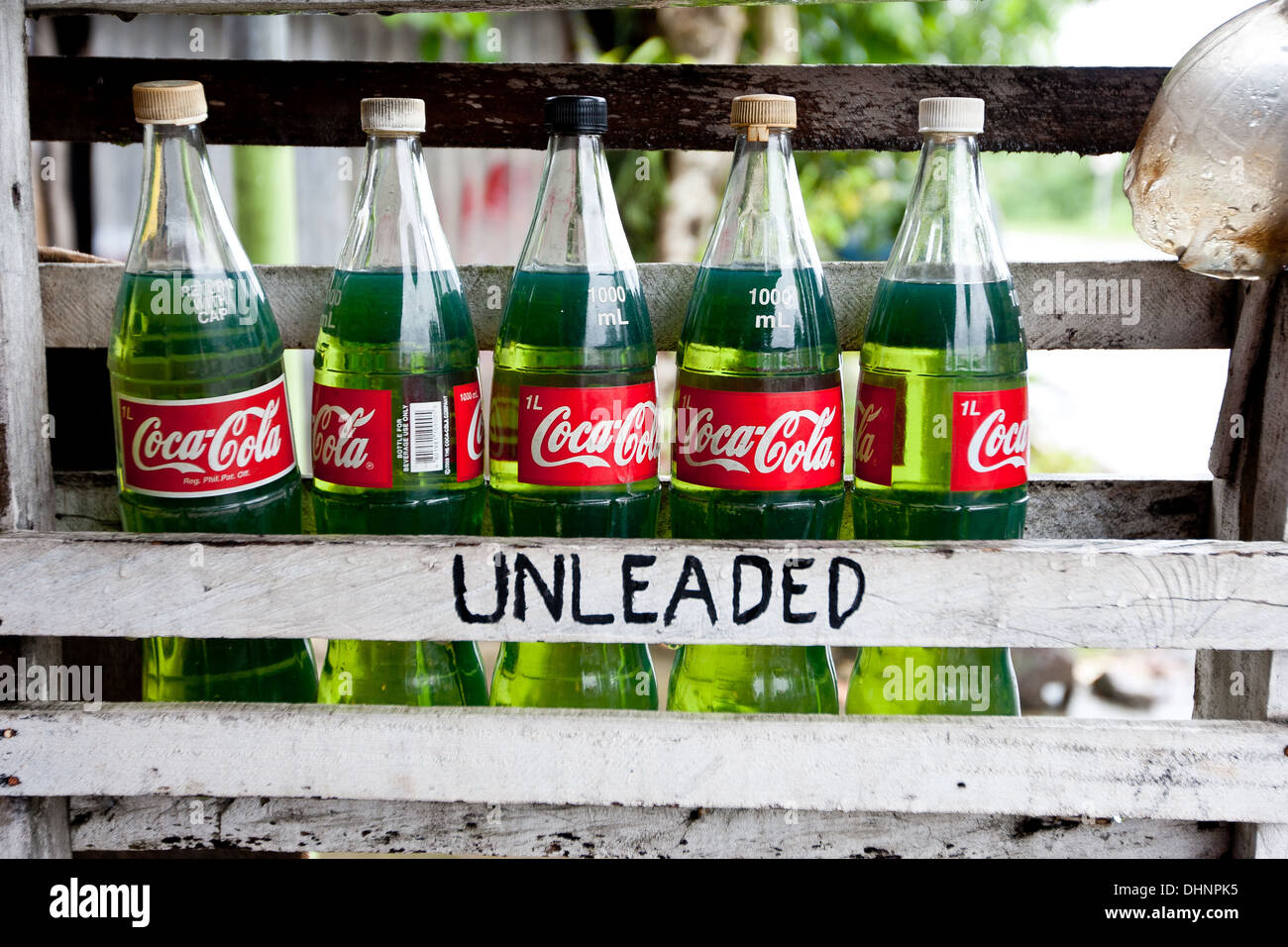 Fuel is bottled for sale at a shop by the roadside in Quezon Province