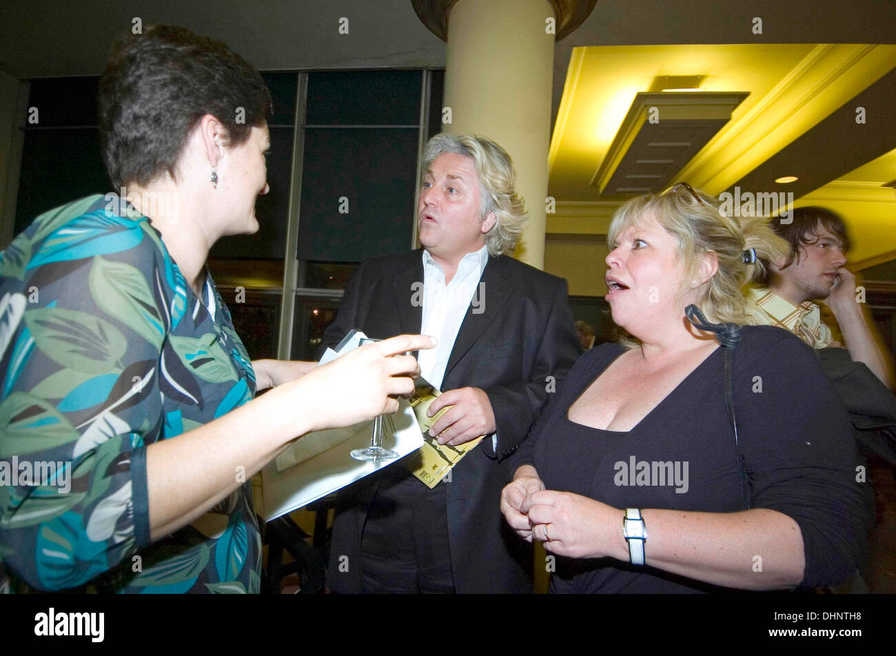 Fashion designer David Emanuel chatting to guests at an aftershow party at the Grand Theatre in Swansea. Stock Photo