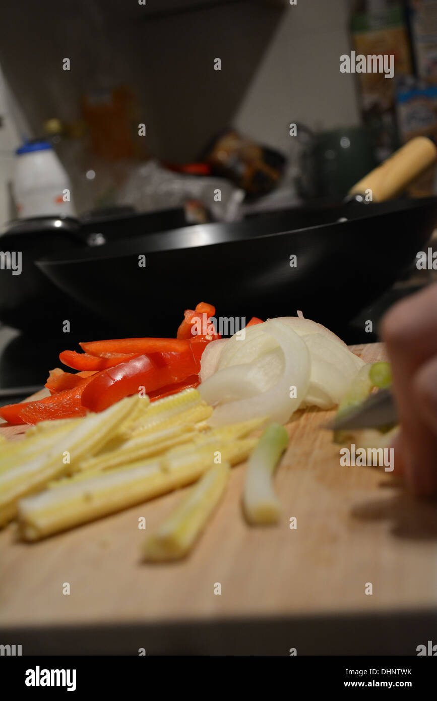 Cooking a mixture of vegetables in a wok. Stock Photo