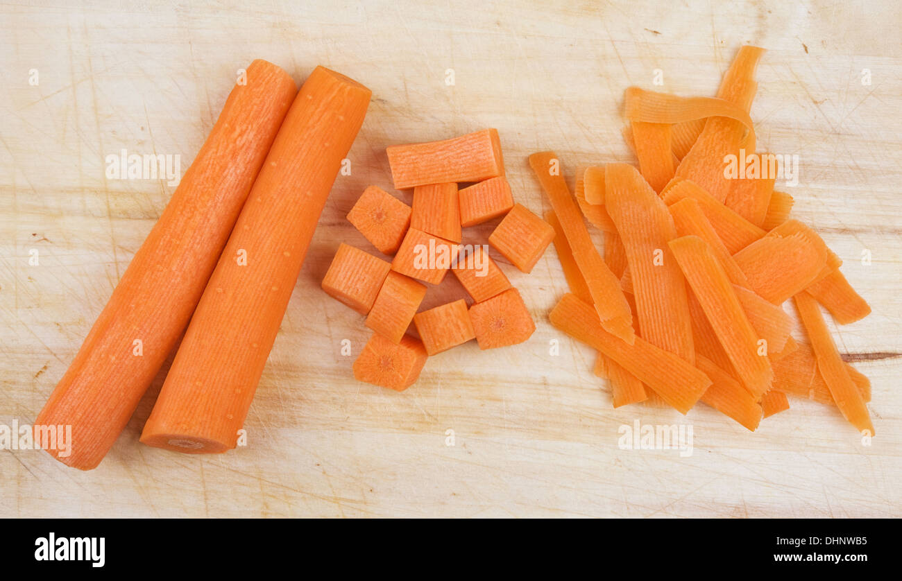 Chef chopping carrot sticks into a small dice, closeup shot. Man performing  good knife skills during cooking a meal Stock Photo - Alamy