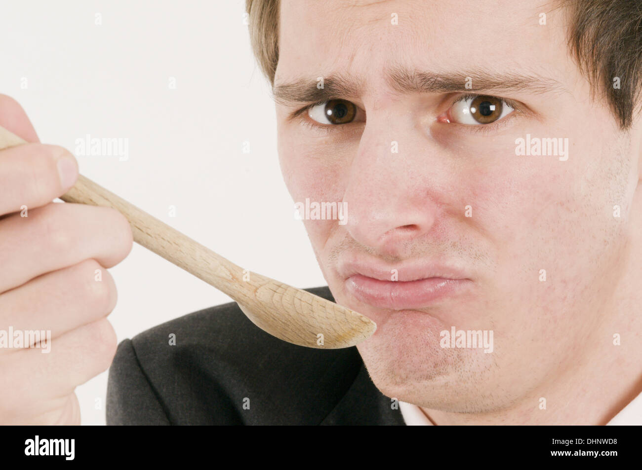 man with wooden spoon Stock Photo