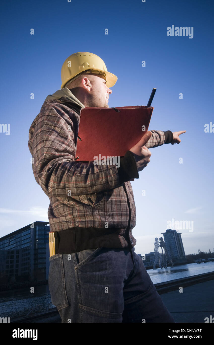 man with helmet show the direction Stock Photo