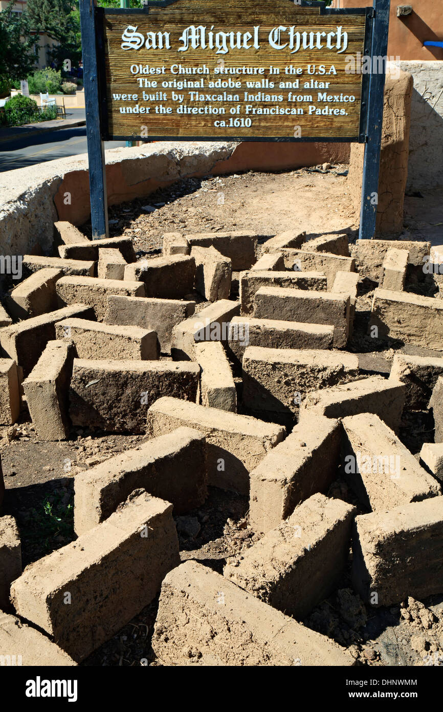 San Miguel Church sign and adobe bricks drying in the sun during ...