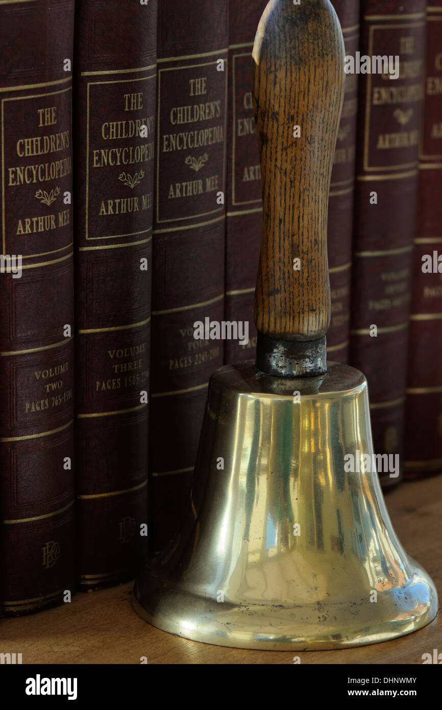 Children's books and old school bell Stock Photo