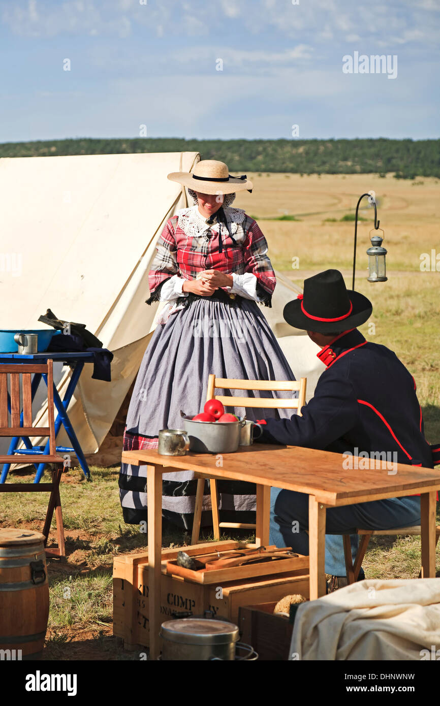 Civil War-Era 'Officer's Wife' and Union soldier chat in camp, historic reenactment, Fort Union National Monument, New Mexico US Stock Photo