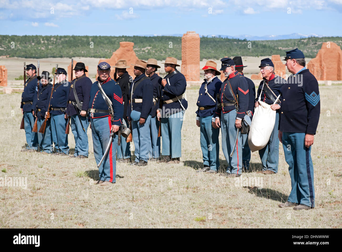 Civil War Era Union soldier reenactors stand in formation before flag-raising ceremony, Fort Union National Monument, NM USA Stock Photo