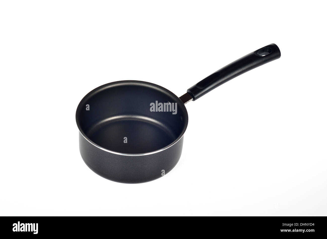Empty black cooking pot or sauce pan with handle on white background, cutout. Stock Photo
