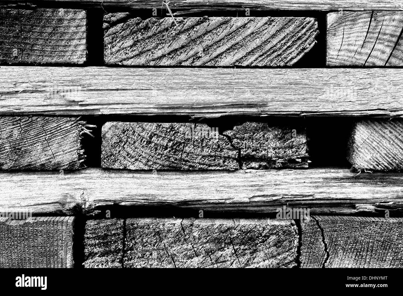 cracked boards stacked black Stock Photo