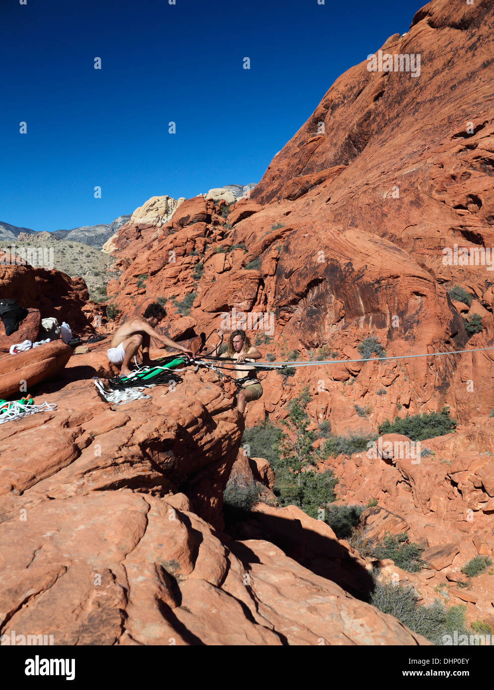 Adventurers set up highline at Red Rock Canyon National Conservation Area Stock Photo