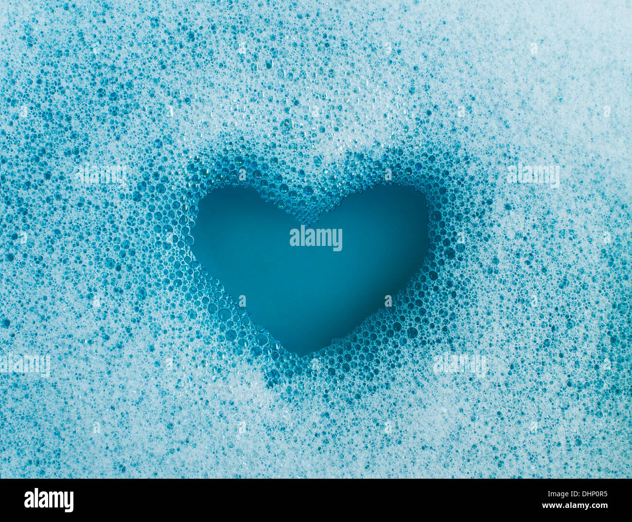 Heart shape created out of soap suds Stock Photo