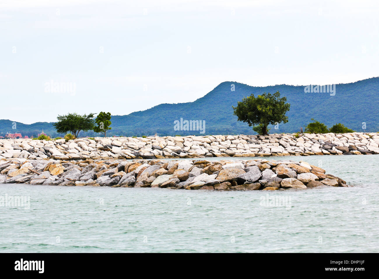 Breakwall rocks at sea coast in Thailand. Stock Photo
