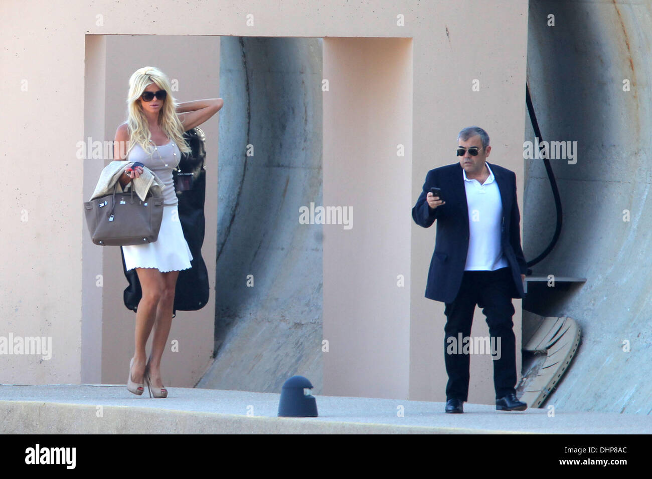 Model Victoria Silvstedt and her boyfriend Maurice Dabbah walking along