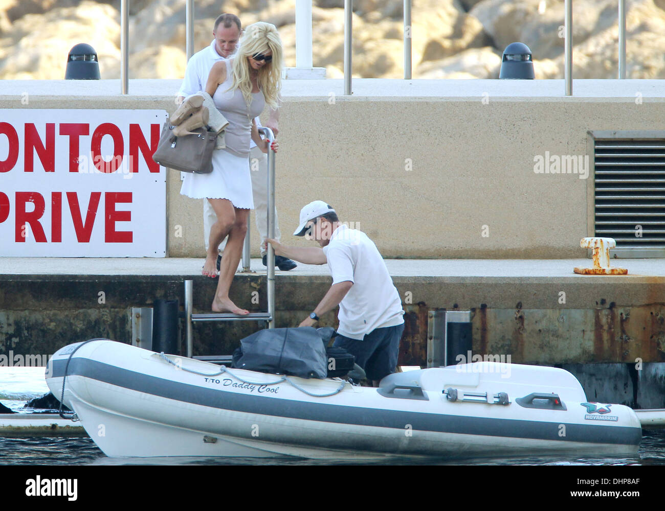 Model Victoria Silvstedt prepares to take a boat across to her