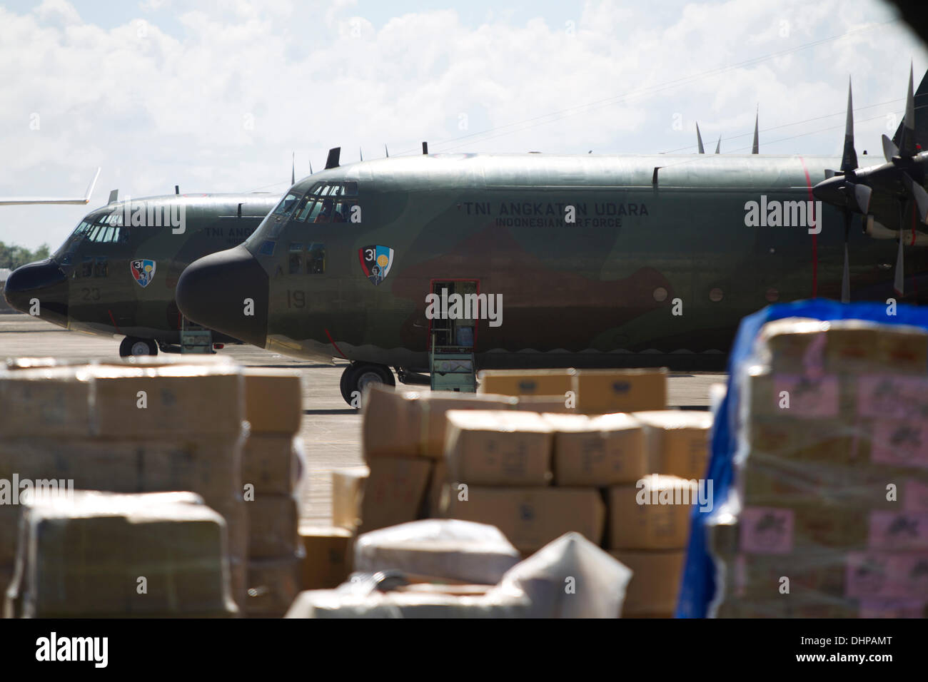 Cebu City, Philippines. 14th Nov, 2013. C130 transport planes continuosly land or depart from Mactan International Airport. Either dropping off evacuees from the hardest hit areas of Leyte and Samar or waiting to be loaded with emergency relief goods for those areas. Credit:  imagegallery2/Alamy Live News Stock Photo