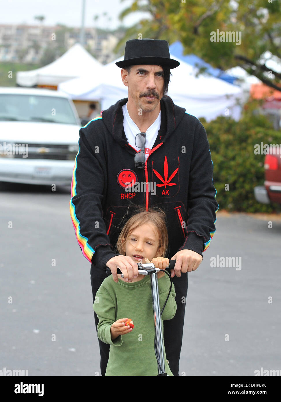 Anthony Kiedis of The Red Hot Chilli Peppers takes a ride on a scooter with his son, Everly Bear Kiedis at Malibu Farmer's Market  Malibu, California - 13.05.12 Stock Photo